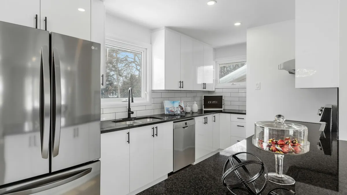 Finished interior kitchen with white cabinetry