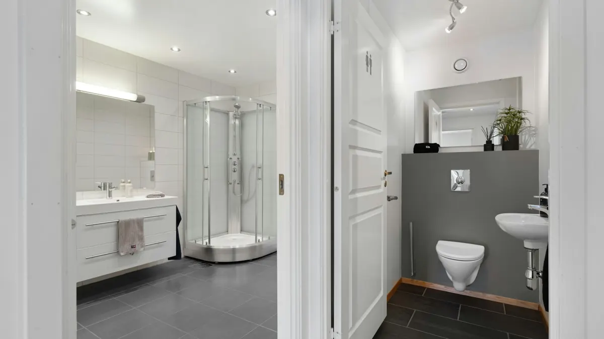 Remodeled bathroom with vanity and corner shower